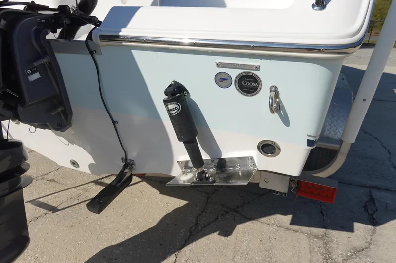 Slide: The Image of 2014 Sea Hunt Ultra 225 boat stern with motor and trim tab details. - 6