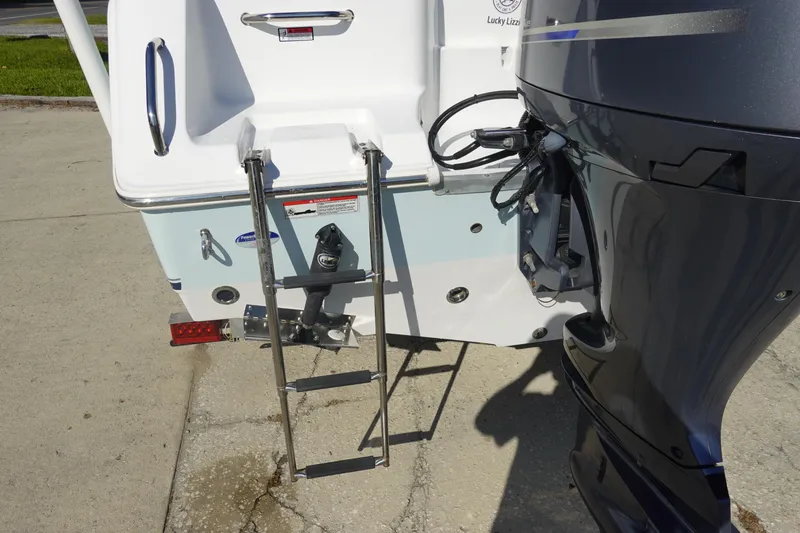 Slide: The Image of Rear view of 2014 Sea Hunt Ultra 225 boat with ladder and motor. - 7