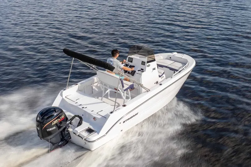 Slide: The Image of 2026 Stingray 173 CC boat cruising on water. - 11