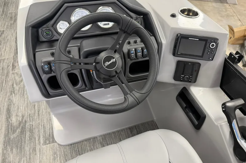 Slide: The Image of 2026 Bentley Pontoons Legacy 243 Swingback dashboard with steering wheel and control panel. - 5