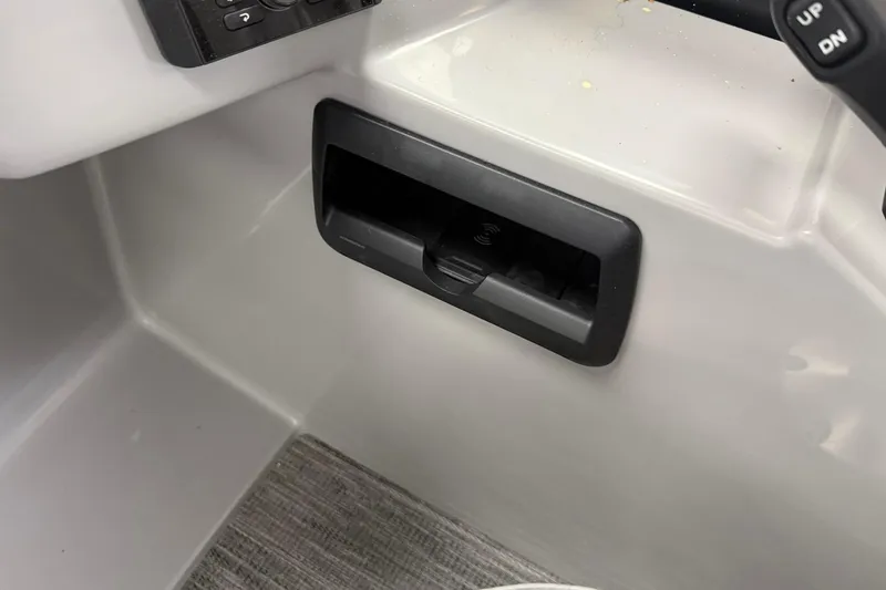 Slide: The Image of Control panel and compartment in 2026 Bentley Pontoons Legacy 243 Swingback boat interior. - 6