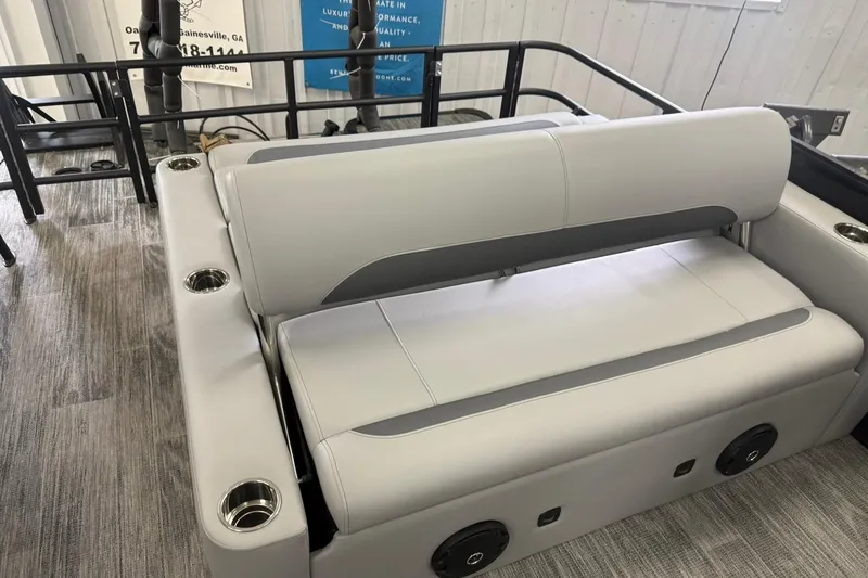 Slide: The Image of 2026 Bentley Pontoons Legacy 243 Swingback interior with plush seating and cup holders. - 8