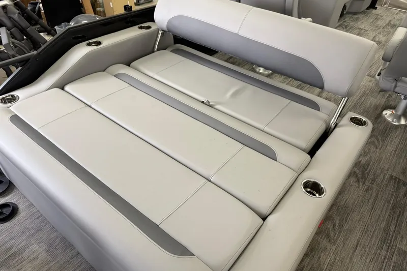Slide: The Image of 2026 Bentley Pontoons Legacy 243 Swingback interior with luxurious seating and cup holders. - 9