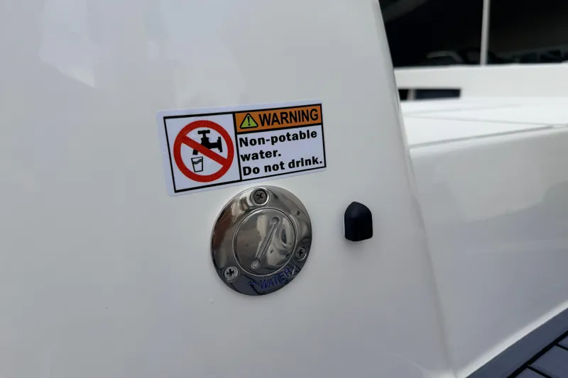 Slide: The Image of 2026 Pathfinder 2400 TRS boat with non-potable water warning label. - 11