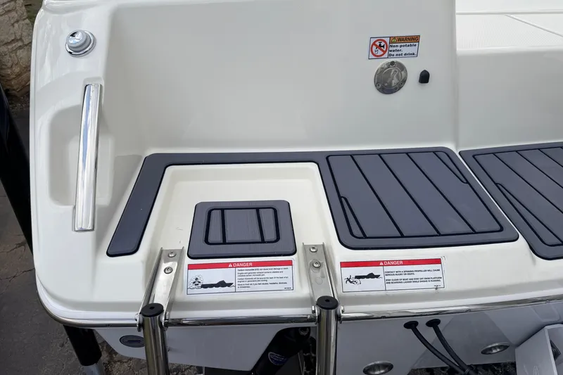 Slide: The Image of 2026 Pathfinder 2400 TRS boat stern with safety warnings and non-potable water notice. - 12