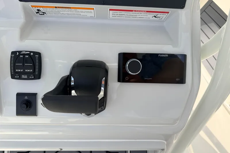 Slide: The Image of Control panel of 2026 Pathfinder 2400 TRS boat with trim tab and audio system. - 16
