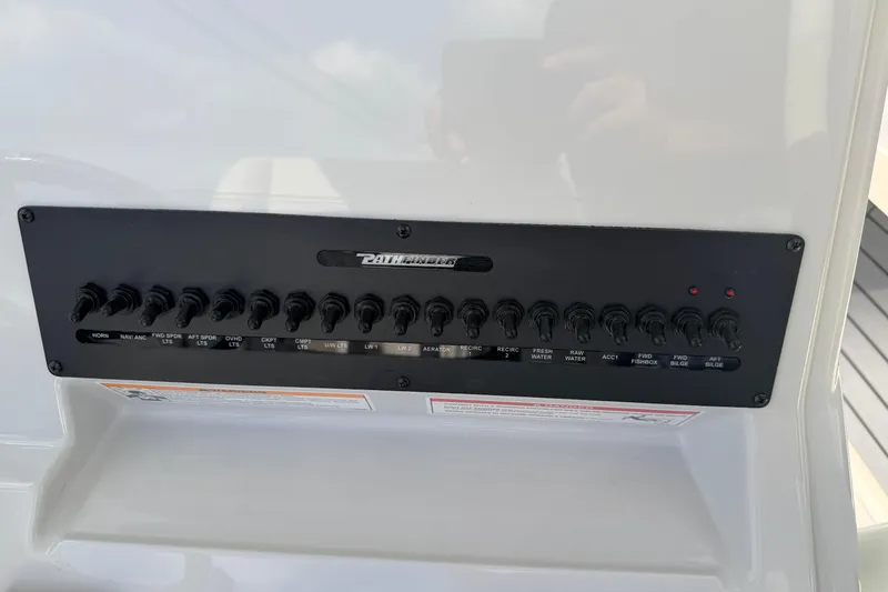 Slide: The Image of Control panel of 2026 Pathfinder 2400 TRS boat with labeled switches. - 17