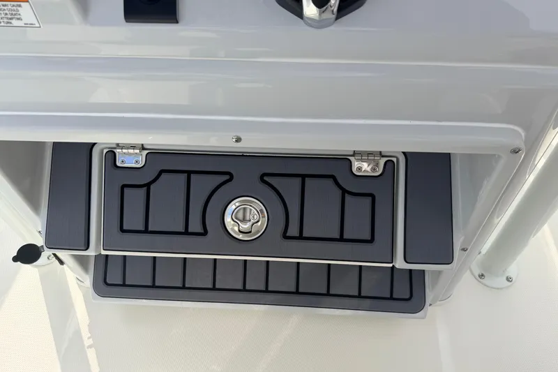 Slide: The Image of 2026 Pathfinder 2400 TRS boat console with storage compartment and latch. - 20