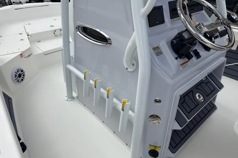 Slide: The Image of 2026 Pathfinder 2400 TRS boat console with steering wheel and rod holders. - 24