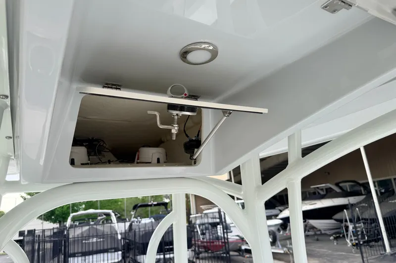 Slide: The Image of Open storage compartment on 2026 Pathfinder 2400 TRS boat, showcasing interior equipment. - 26