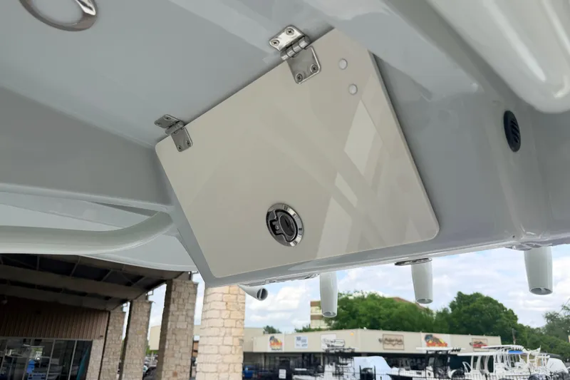 Slide: The Image of 2026 Pathfinder 2400 TRS boat detail showing storage compartment with latch. - 27
