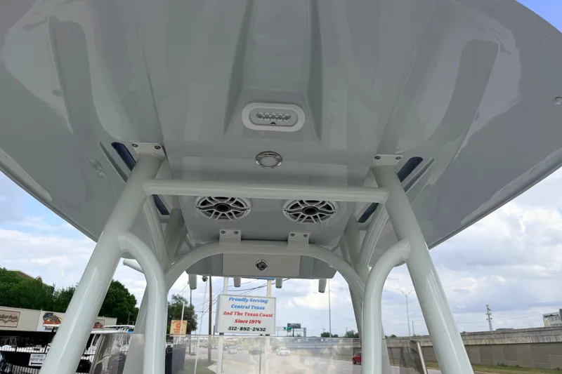 Slide: The Image of 2026 Pathfinder 2400 TRS boat T-top with speakers and lighting, viewed from below. - 31