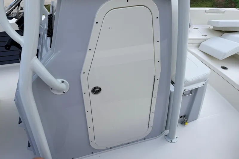 Slide: The Image of 2026 Pathfinder 2400 TRS boat console with storage compartment and seating area. - 34