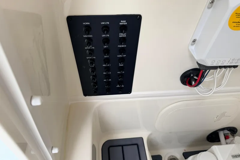 Slide: The Image of Control panel of 2026 Pathfinder 2400 TRS boat with labeled switches and wiring. - 37