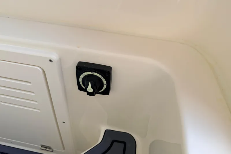 Slide: The Image of Control panel on 2026 Pathfinder 2400 TRS boat interior, featuring a dial switch. - 38