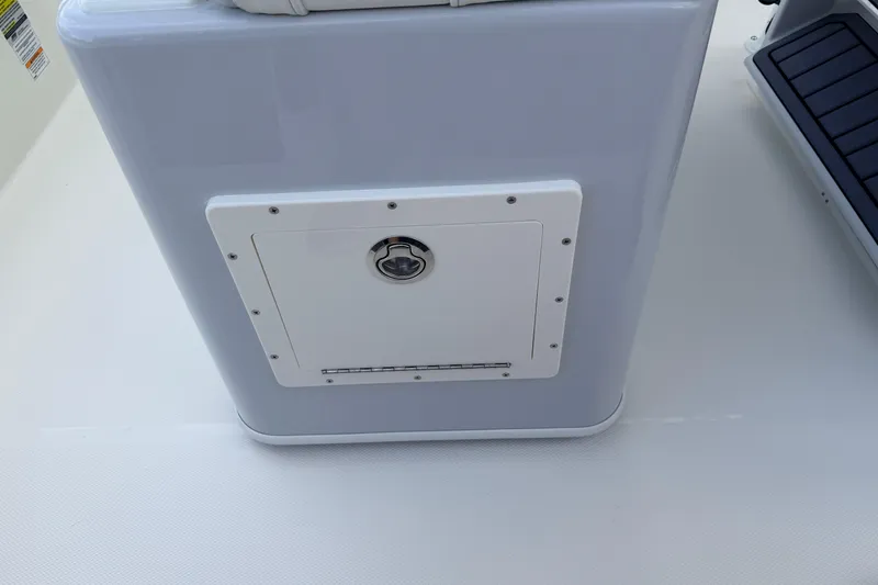 Slide: The Image of 2026 Pathfinder 2400 TRS boat compartment with secure latch on deck. - 42