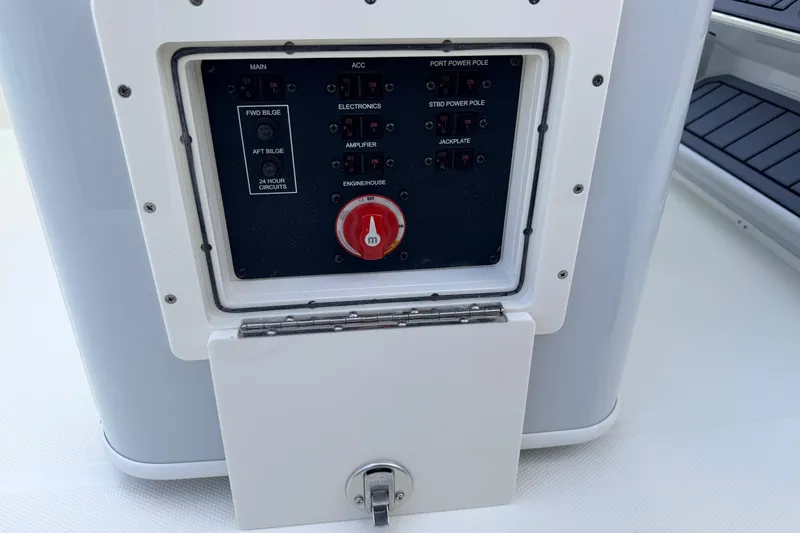 Slide: The Image of Electrical control panel on 2026 Pathfinder 2400 TRS boat, featuring switches and a red dial. - 43