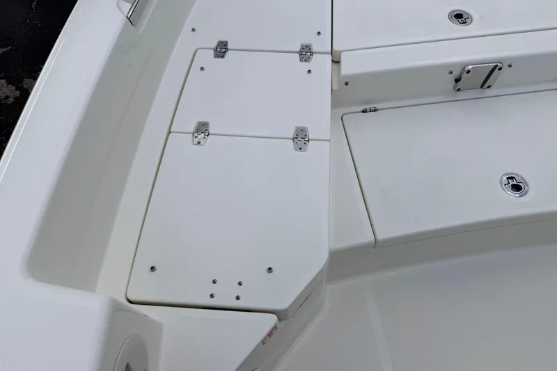 Slide: The Image of 2026 Pathfinder 2400 TRS boat deck with storage compartments and sleek design. - 50