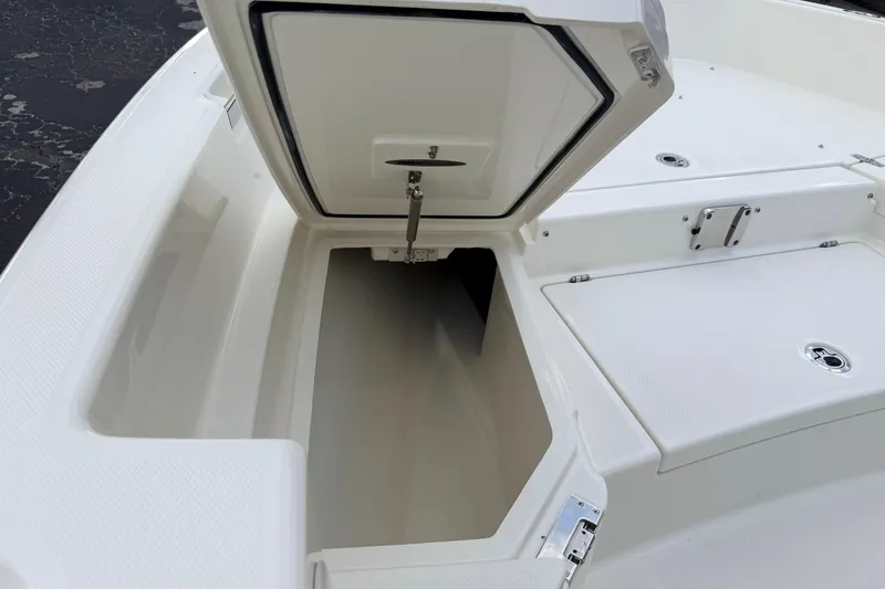 Slide: The Image of Open storage compartment on 2026 Pathfinder 2400 TRS boat deck. - 51