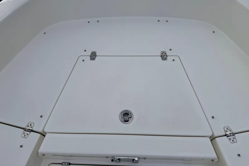 Slide: The Image of 2026 Pathfinder 2400 TRS boat deck with storage compartment and secure latch. - 54