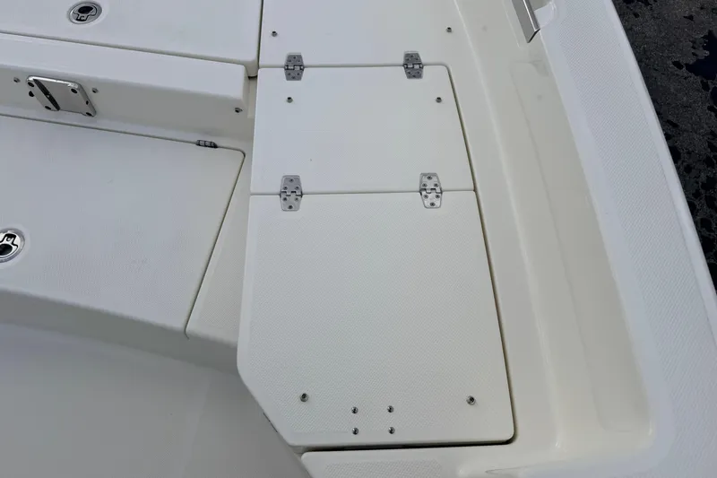 Slide: The Image of 2026 Pathfinder 2400 TRS boat deck with storage compartments and stainless steel hinges. - 56