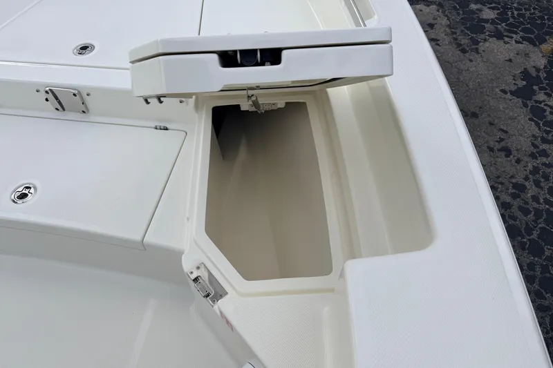Slide: The Image of Open storage compartment on 2026 Pathfinder 2400 TRS boat deck. - 57