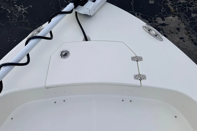 Slide: The Image of Bow of 2026 Pathfinder 2400 TRS boat with storage hatch and cleat. - 58