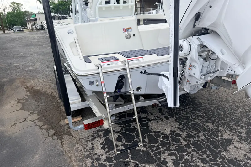 Slide: The Image of 2026 Pathfinder 2400 TRS boat rear view with ladder and motor details. - 6