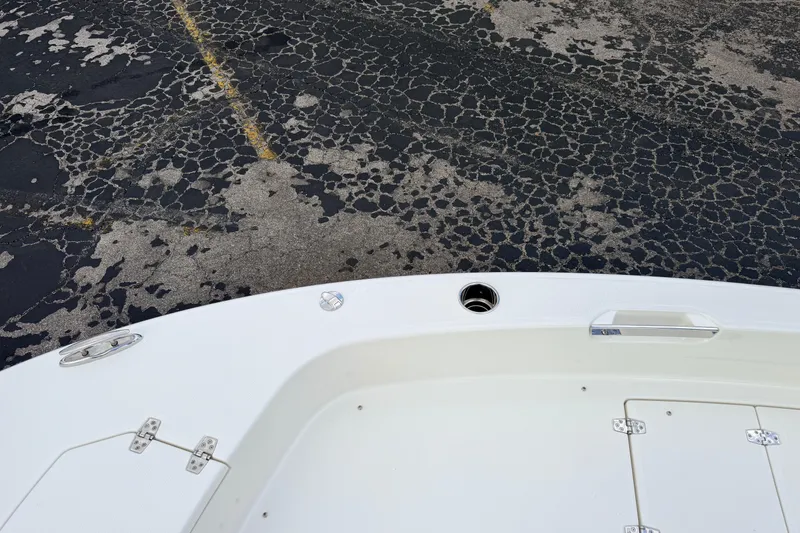 Slide: The Image of Bow of 2026 Pathfinder 2400 TRS boat on cracked asphalt surface. - 60