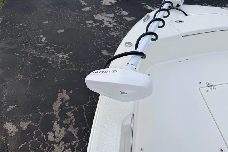 Slide: The Image of 2026 Pathfinder 2400 TRS boat with Garmin trolling motor on deck. - 62