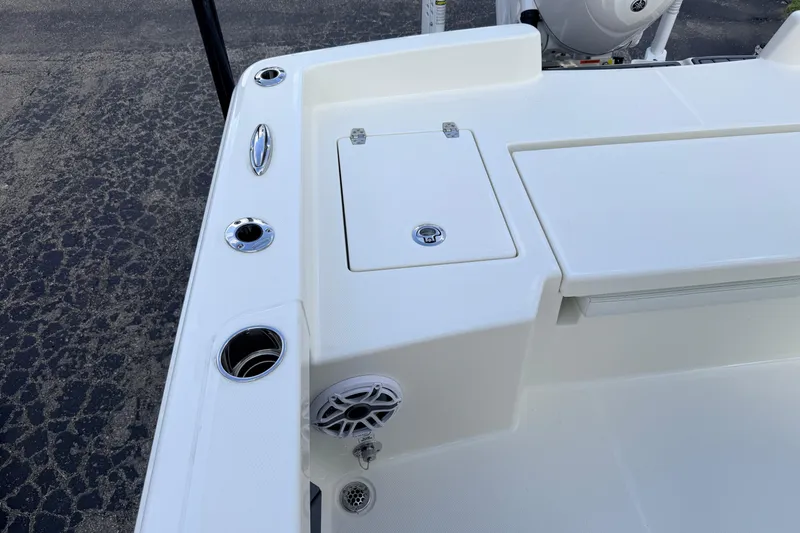 Slide: The Image of 2026 Pathfinder 2400 TRS boat deck with storage compartments and cup holders. - 69