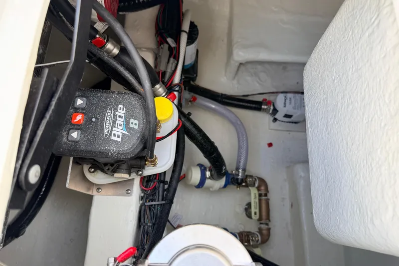 Slide: The Image of Interior view of 2026 Pathfinder 2400 TRS boat showing Power-Pole Blade 8 hydraulic system. - 76