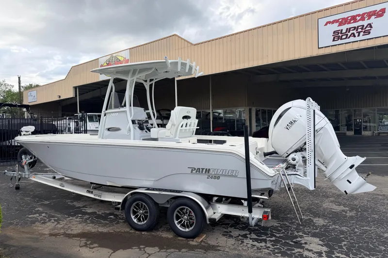 Slide: The Image of 2026 Pathfinder 2400 TRS boat with Yamaha engine on trailer outside dealership. - 8