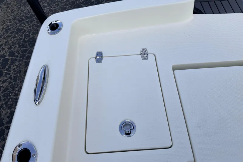 Slide: The Image of 2026 Pathfinder 2400 TRS boat deck with storage compartment and chrome fittings. - 80