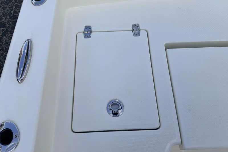 Slide: The Image of Hatch on 2026 Pathfinder 2400 TRS boat deck, featuring stainless steel hardware. - 81