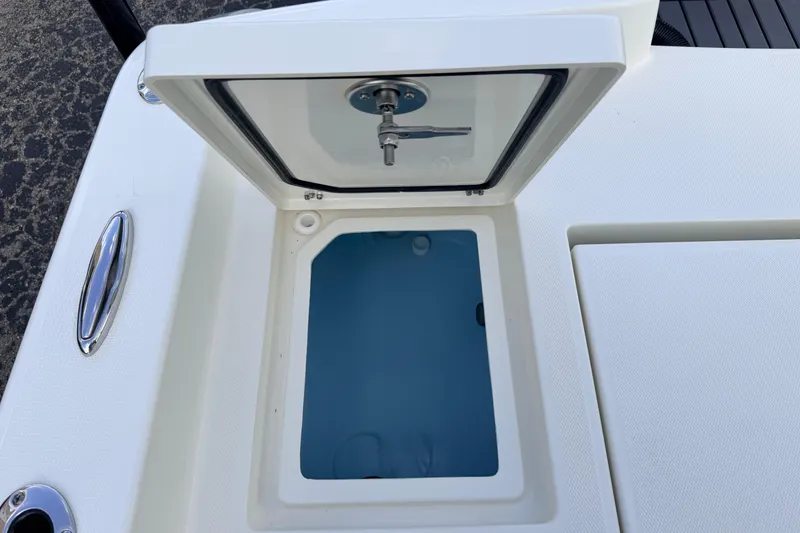 Slide: The Image of Open storage compartment on 2026 Pathfinder 2400 TRS boat deck. - 82