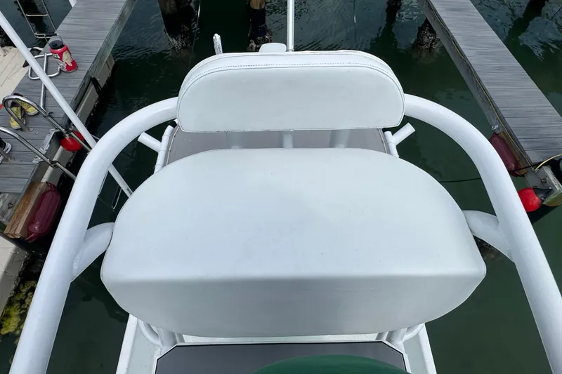 Slide: The Image of View from Blazer Bay 2400 boat seat, overlooking marina docks, 2023 model. - 12