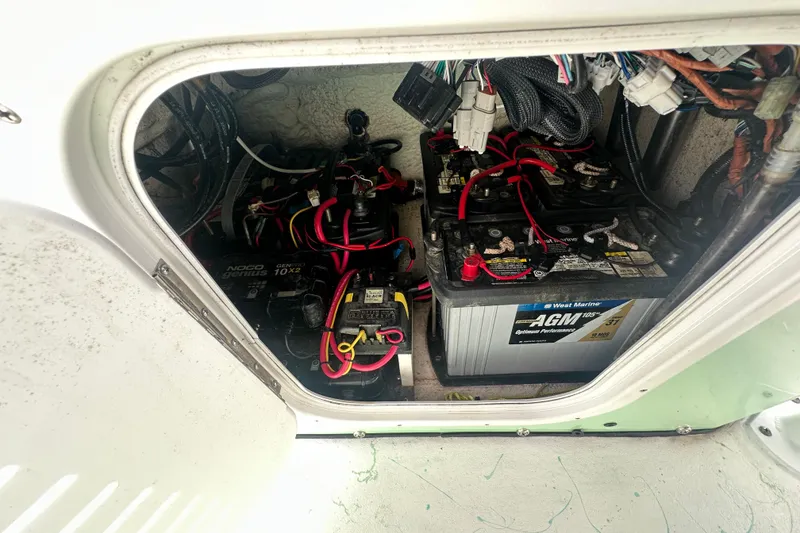 Slide: The Image of Battery compartment of 2023 Blazer Bay 2400 with AGM marine batteries and wiring. - 14