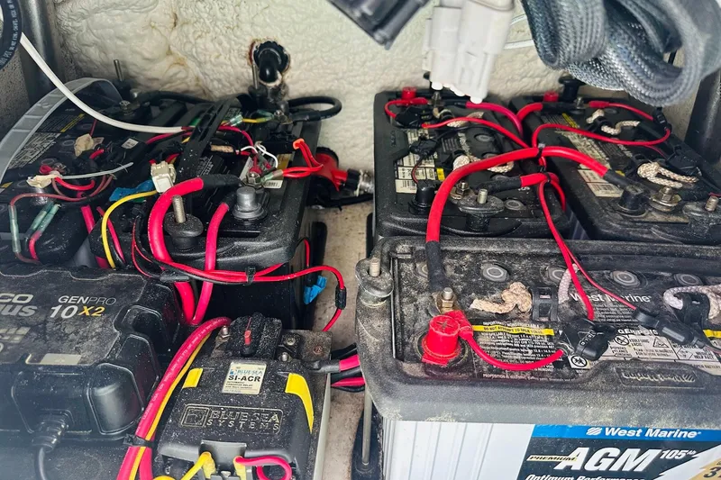 Slide: The Image of Battery setup in a 2023 Blazer Bay 2400 boat, featuring AGM and GenPro systems. - 46