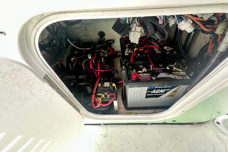 Slide: The Image of Battery compartment of 2023 Blazer Bay 2400 boat with AGM and NOCO Genius chargers. - 47