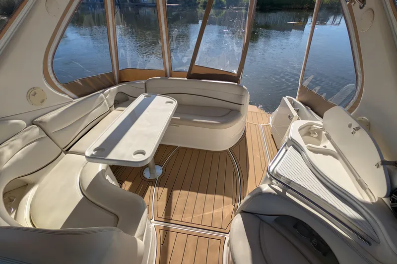 Slide: The Image of Luxurious interior of 2001 Wellcraft 3300 Martinique boat with seating and table. - 13