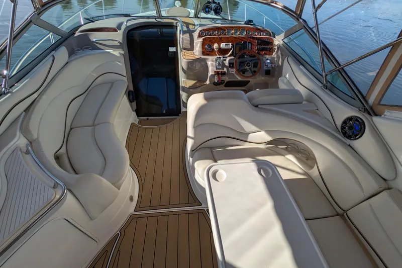 Slide: The Image of Luxurious interior of 2001 Wellcraft 3300 Martinique boat with plush seating and elegant dashboard. - 14