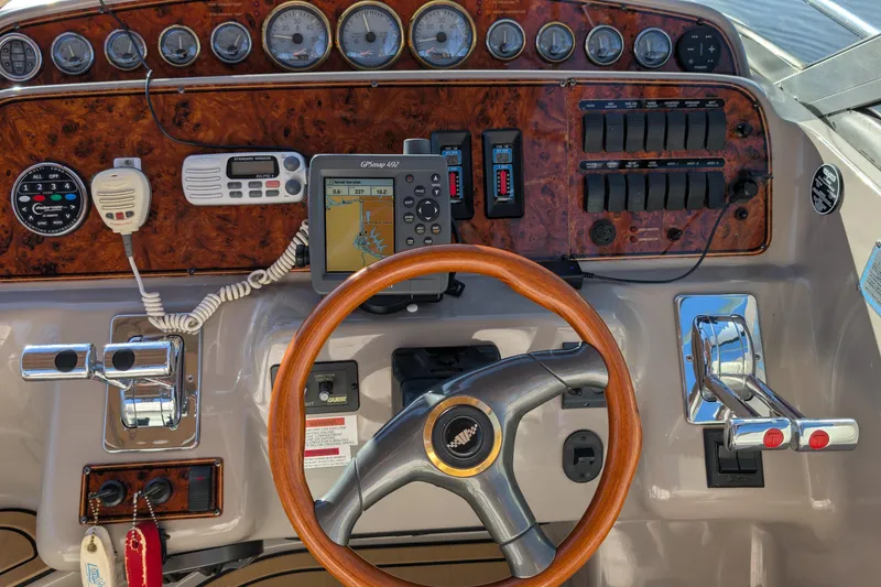 Slide: The Image of Dashboard of a 2001 Wellcraft 3300 Martinique boat with GPS and controls. - 25