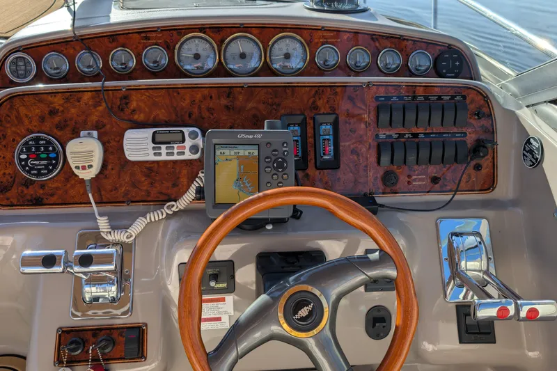 Slide: The Image of Dashboard of a 2001 Wellcraft 3300 Martinique boat with GPS and controls. - 26