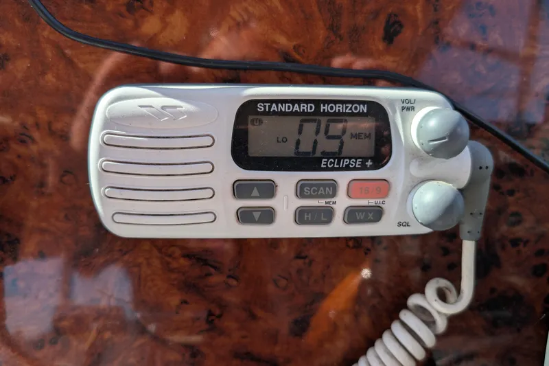 Slide: The Image of Standard Horizon Eclipse+ marine radio on 2001 Wellcraft 3300 Martinique boat dashboard. - 29