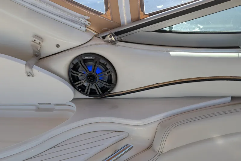 Slide: The Image of Interior of 2001 Wellcraft 3300 Martinique boat with speaker and seating. - 36