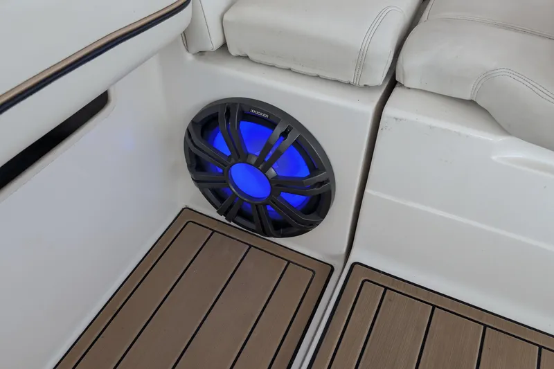 Slide: The Image of Speaker with blue LED light on 2001 Wellcraft 3300 Martinique boat interior. - 38