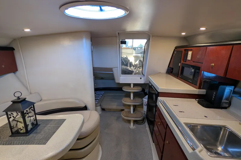 Slide: The Image of Interior of 2001 Wellcraft 3300 Martinique yacht with kitchenette and seating area. - 39