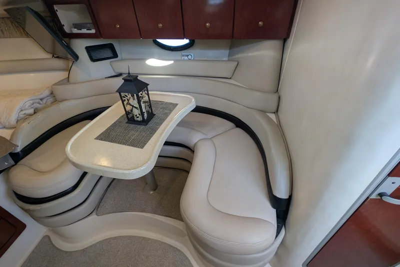 Slide: The Image of Interior of 2001 Wellcraft 3300 Martinique boat with curved seating and table. - 44