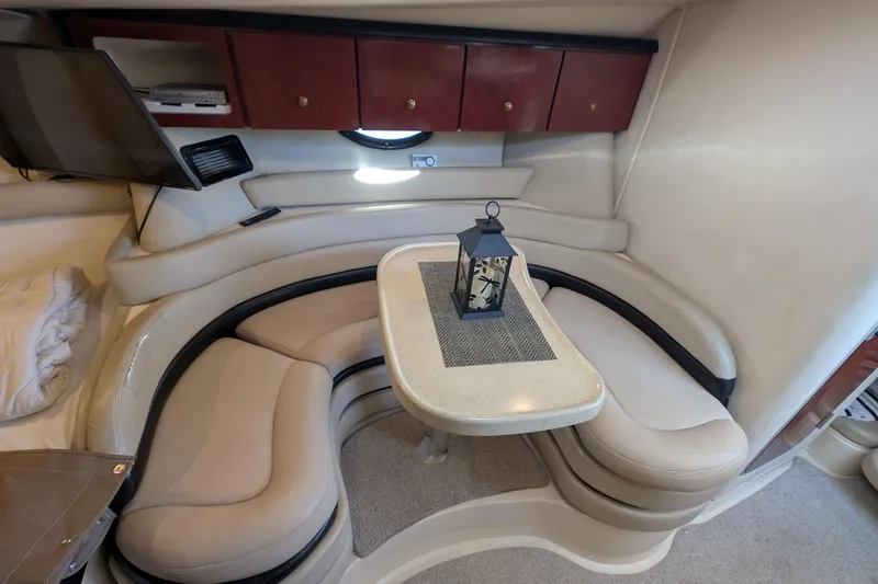 Slide: The Image of Interior of 2001 Wellcraft 3300 Martinique yacht with cozy seating and table. - 45